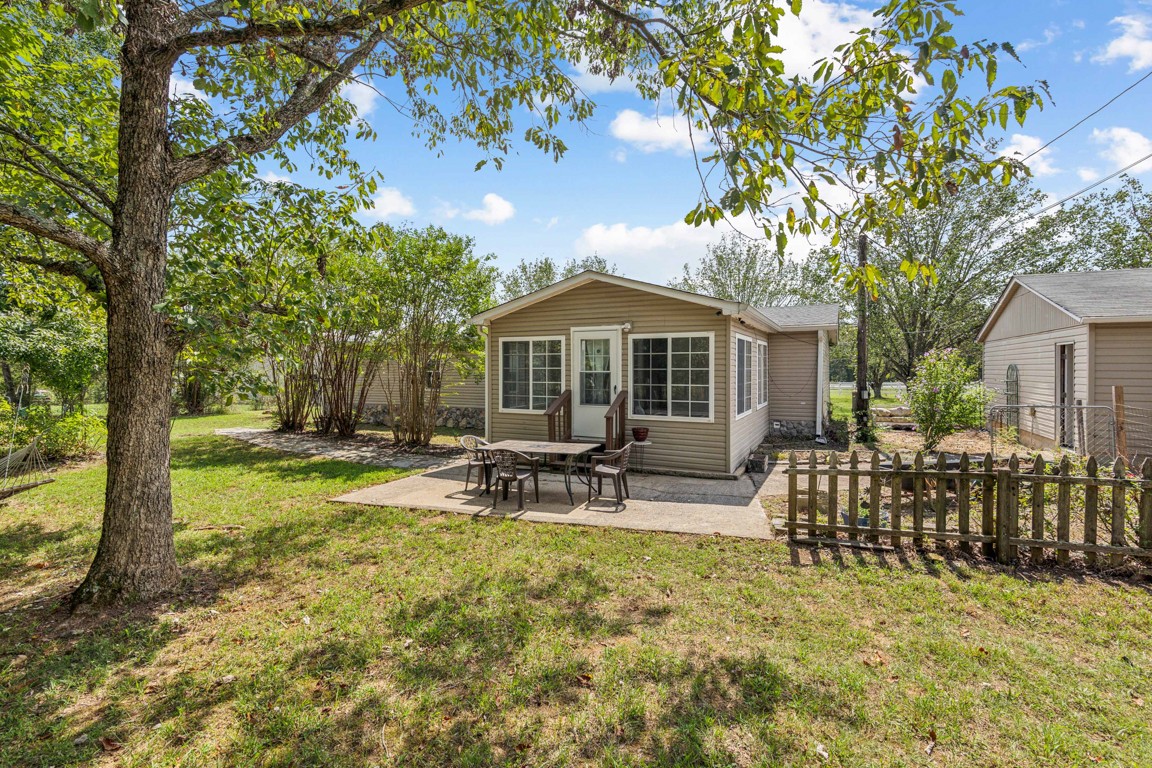 11201 New Zion Road Christiana, TN 37037 - Photo 12 of 19 a view of a house with backyard and sitting area