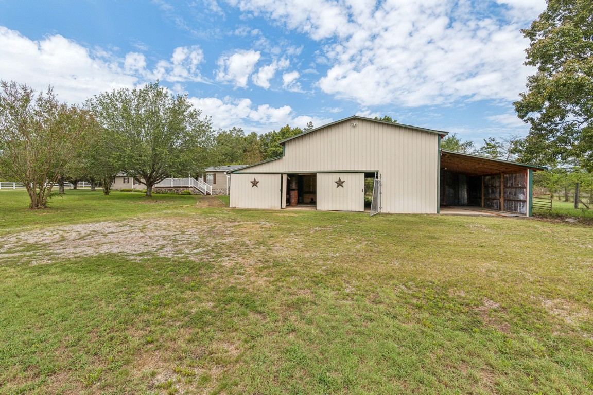 11201 New Zion Road Christiana, TN 37037 - Photo 14 of 19 a front view of a house with garden