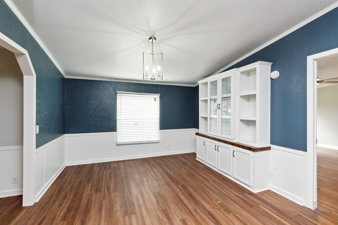 11201 New Zion Road Christiana, TN 37037 - Photo 4 of 19 a view of an empty room with a window and wooden floor