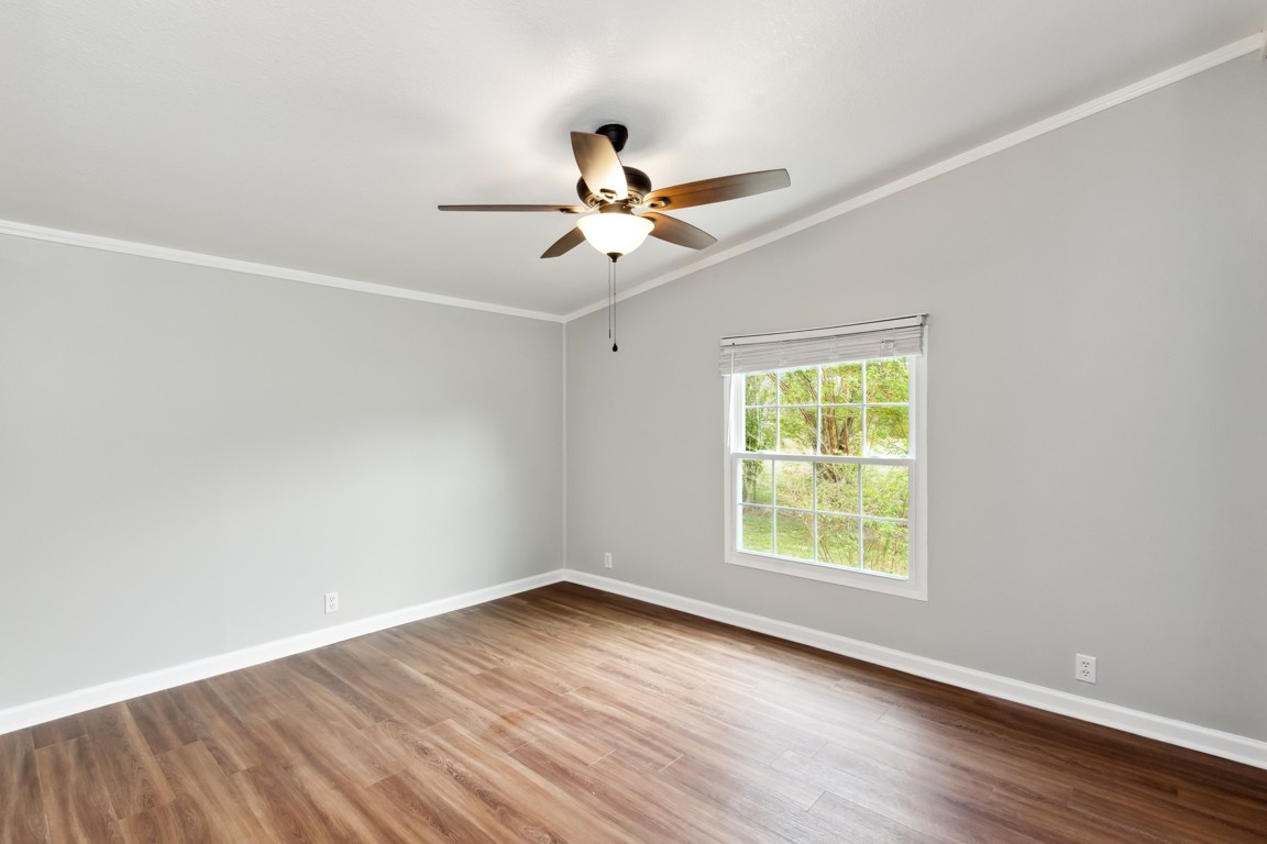 11201 New Zion Road Christiana, TN 37037 - Photo 9 of 19 an empty room with wooden floor and windows