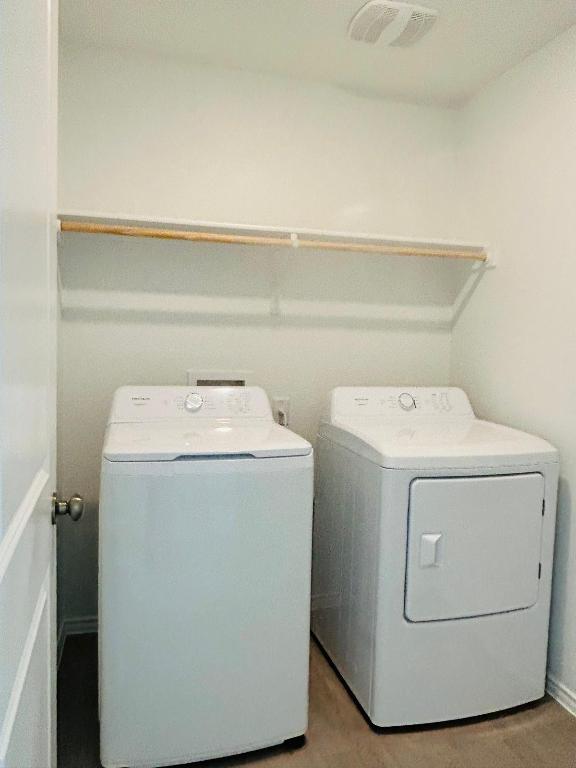 521 Cattle Queen Road Jarrell, TX 76537 - Photo 13 of 16 a utility room with dryer and washer