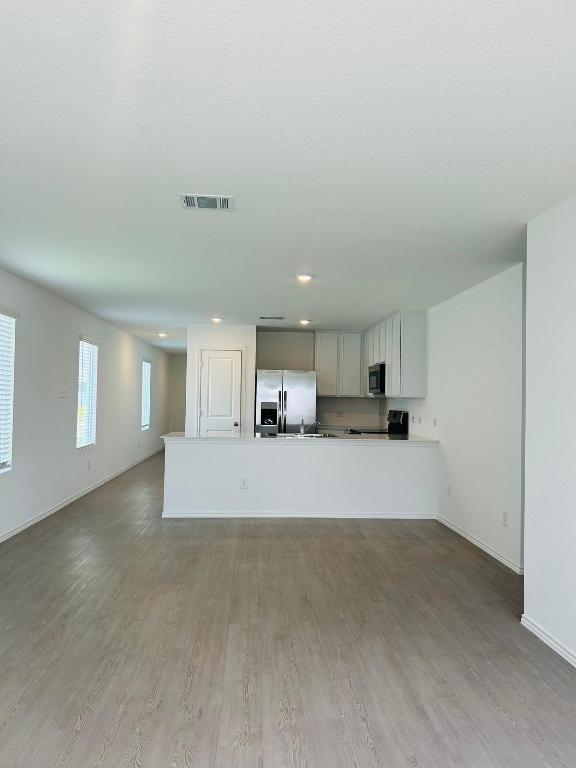 521 Cattle Queen Road Jarrell, TX 76537 - Photo 4 of 16 a view of a kitchen with a sink and a window