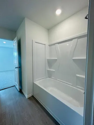 a view of a kitchen with a sink and a window