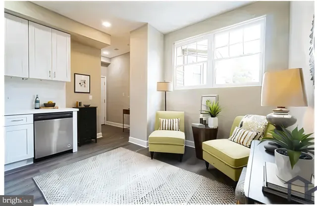 a living room with furniture flowerpot and a window