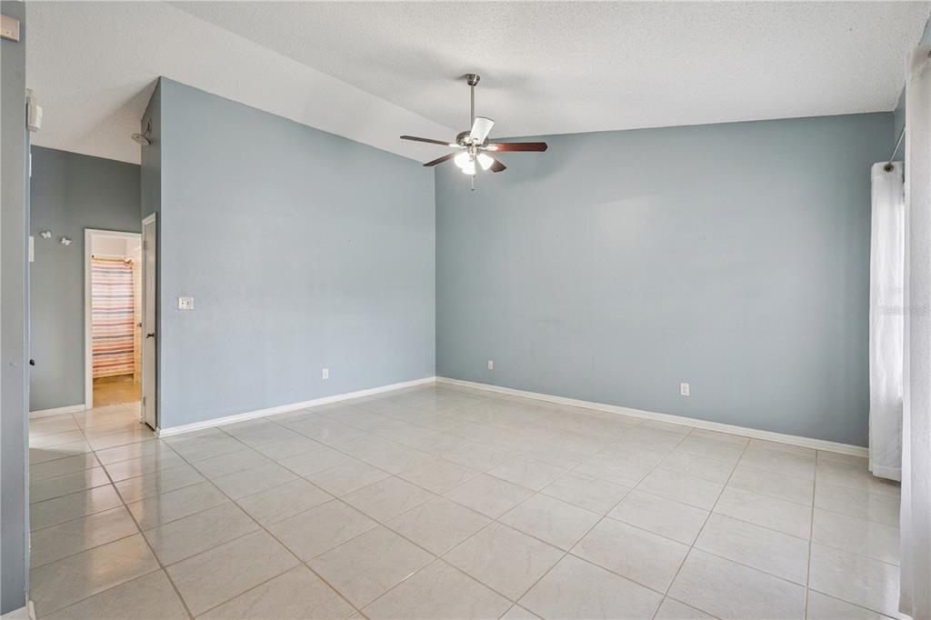 518 Torrey Avenue Altamonte Springs, FL 32714 - Photo 11 of 27 an empty room with closet and a ceiling fan