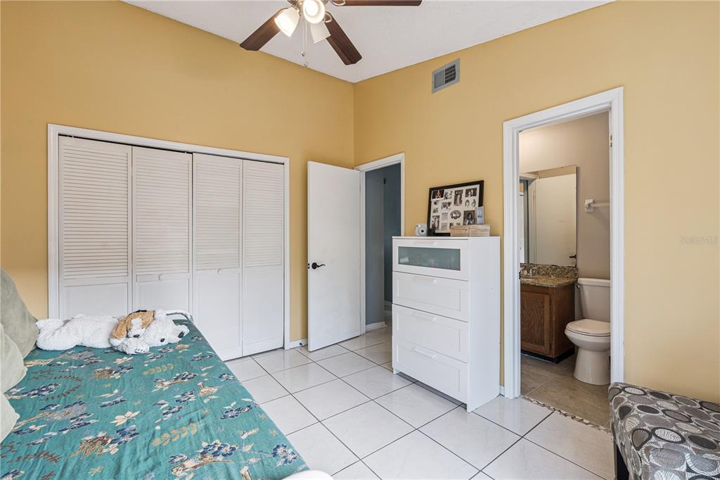 518 Torrey Avenue Altamonte Springs, FL 32714 - Photo 15 of 27 a spacious bathroom with a granite countertop sink and a mirror
