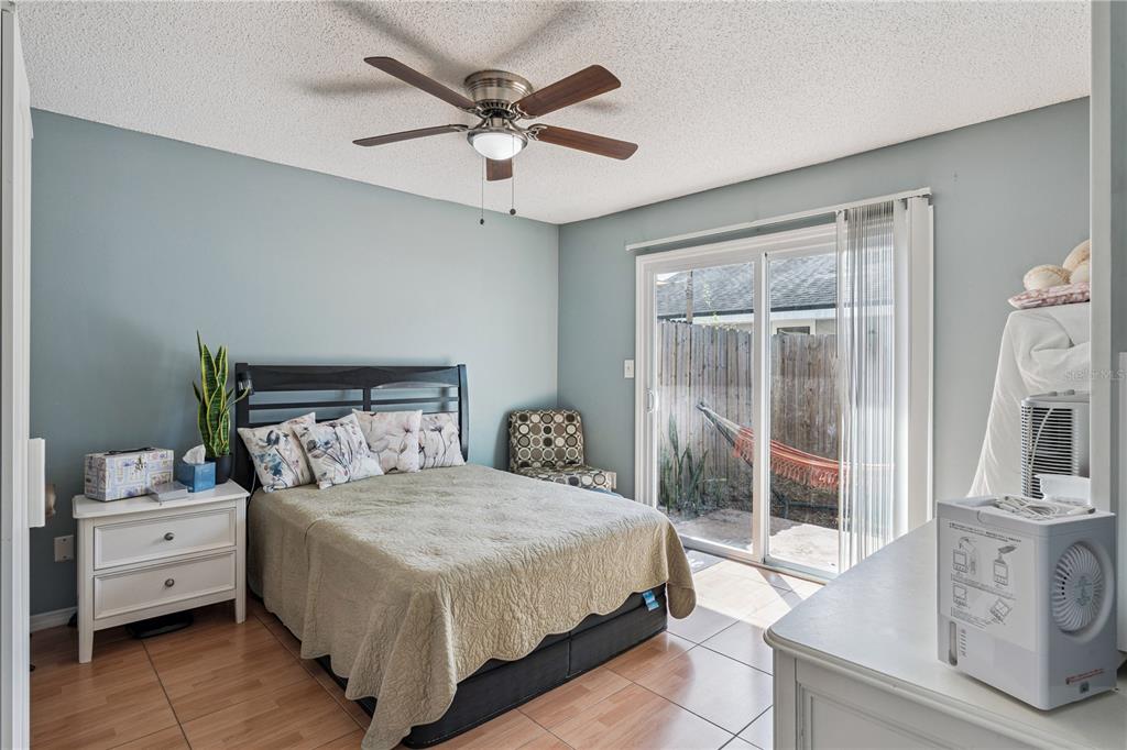 518 Torrey Avenue Altamonte Springs, FL 32714 - Photo 19 of 27 a bedroom with a bed and a chandelier