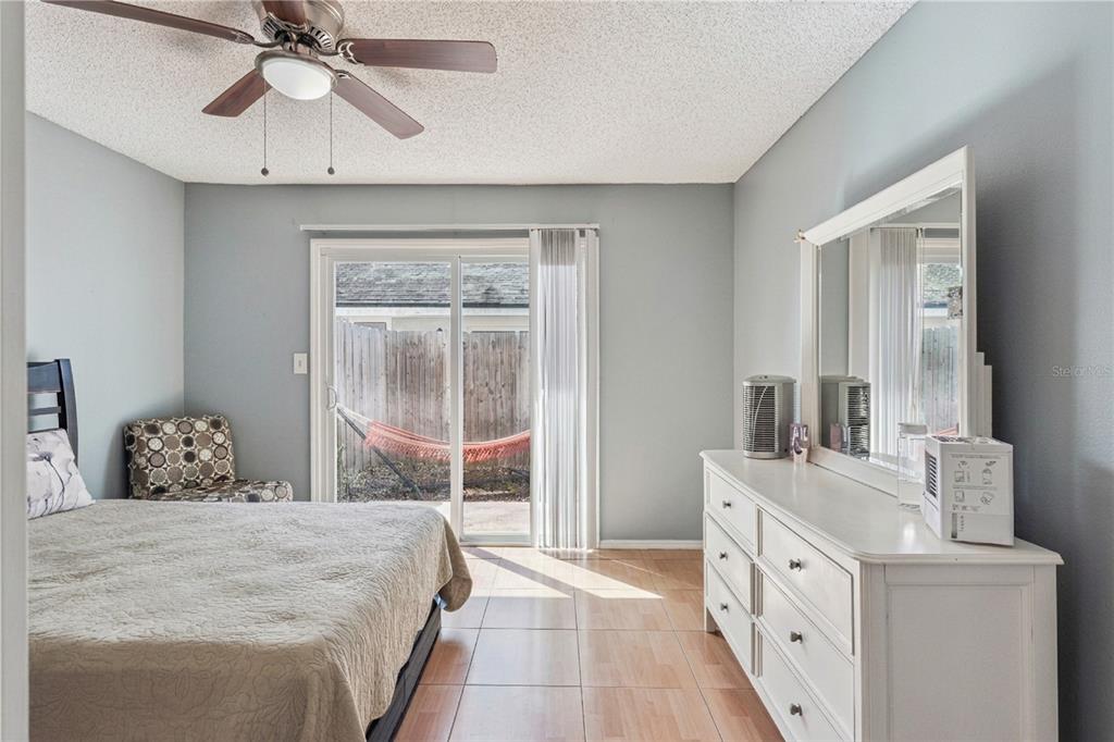 518 Torrey Avenue Altamonte Springs, FL 32714 - Photo 22 of 27 a bedroom with a bed and a chandelier