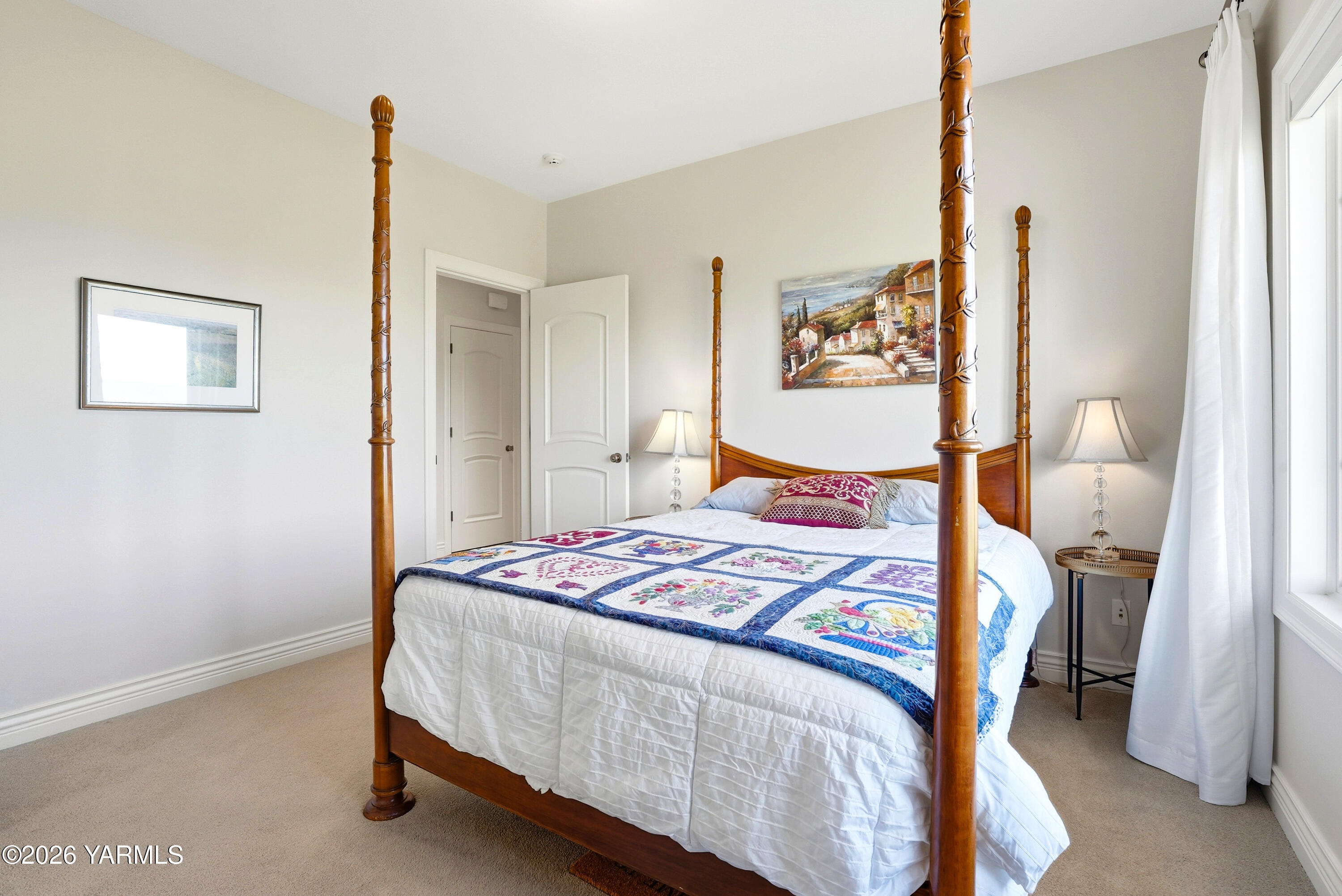 660 Noble Hill Road Yakima, WA 98908 - Photo 29 of 63 a bedroom with a bed and a painting on the wall