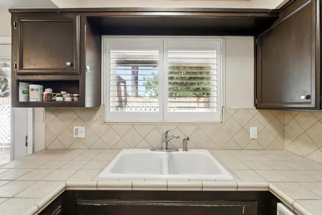 a white refrigerator freezer sitting inside of a kitchen