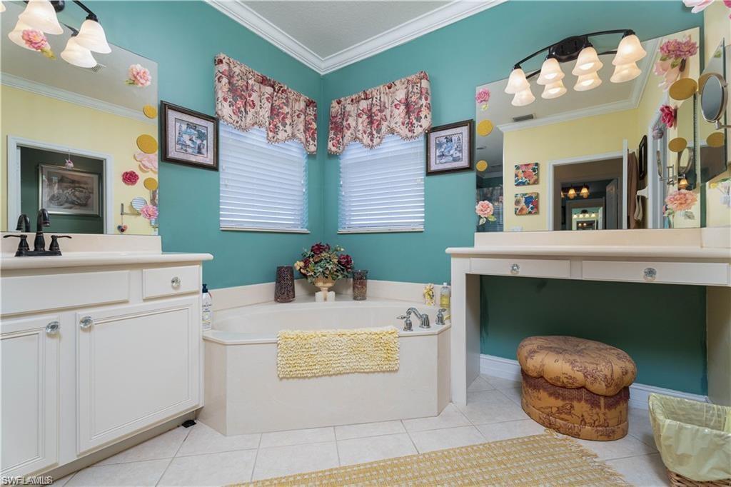 1562 Double Eagle Trail Naples, FL 34120 - Photo 12 of 13 a living room with furniture and a fireplace