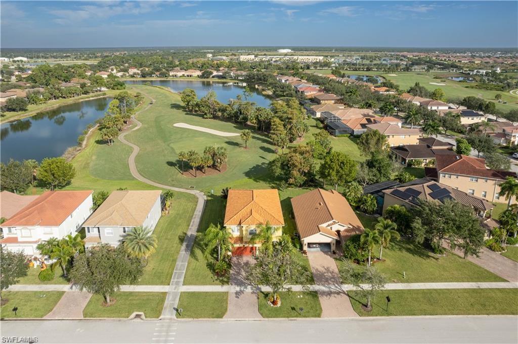 1562 Double Eagle Trail Naples, FL 34120 - Photo 13 of 13 an aerial view of residential houses with outdoor space and swimming pool