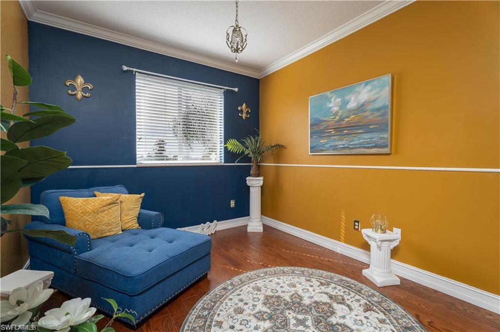 1562 Double Eagle Trail Naples, FL 34120 - Photo 7 of 13 a bedroom with a bed and window