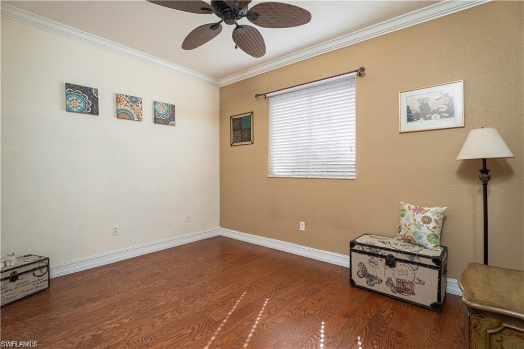 1562 Double Eagle Trail Naples, FL 34120 - Photo 9 of 13 a room with furniture and a window