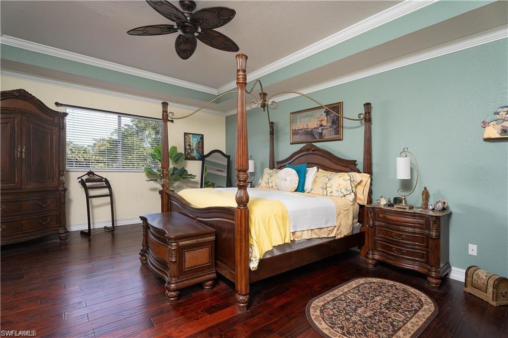 1562 Double Eagle Trail Naples, FL 34120 - Photo 10 of 13 a bed room with a bed and a window