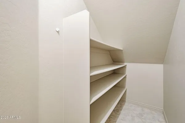 a view of an empty walk in closet