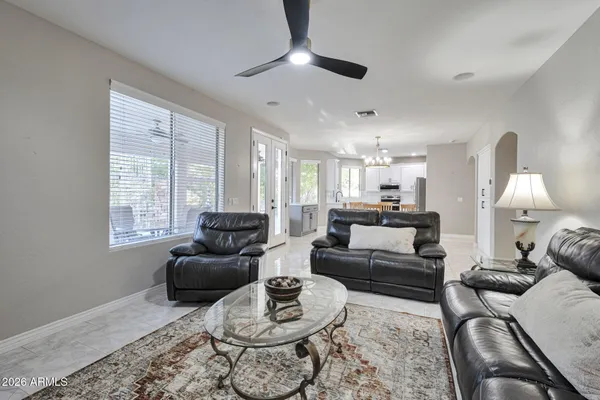 a living room with furniture and a large window