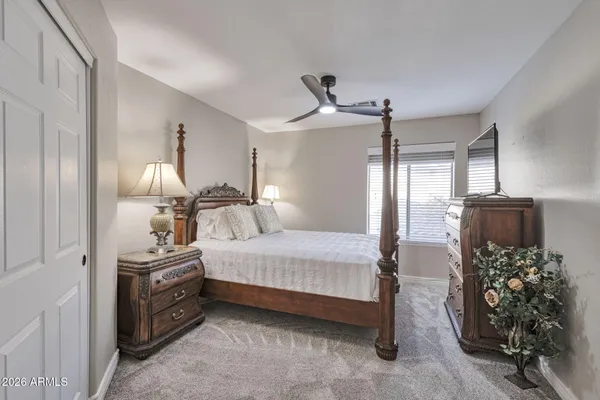 a spacious bathroom with a double vanity sink mirror and next to a window