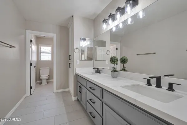 a bathroom with a toilet and a bathtub