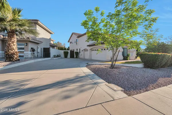 a view of a house with potted plants