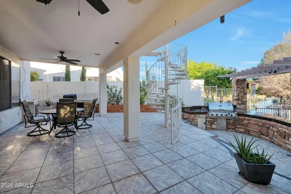 a outdoor space with lots of tables a garden view and chairs