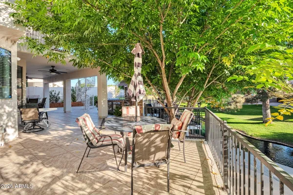 a view of a patio with a table and chairs and couches