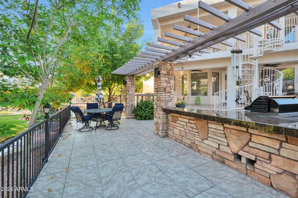 a view of a patio with a table and chairs