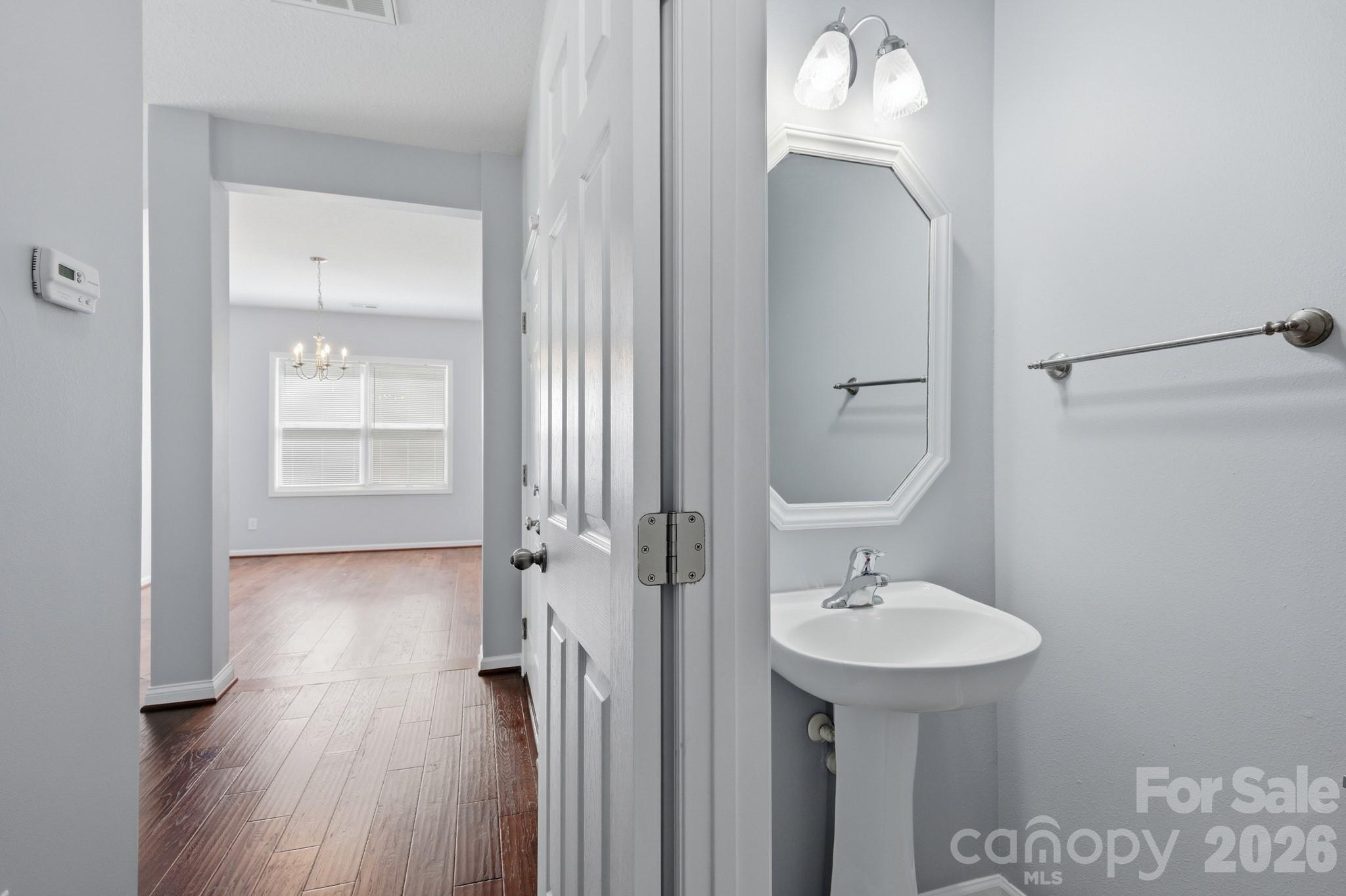 6404 Trotters Ridge Road Charlotte, NC 28227 - Photo 16 of 29 a bathroom with a sink a mirror and a shower