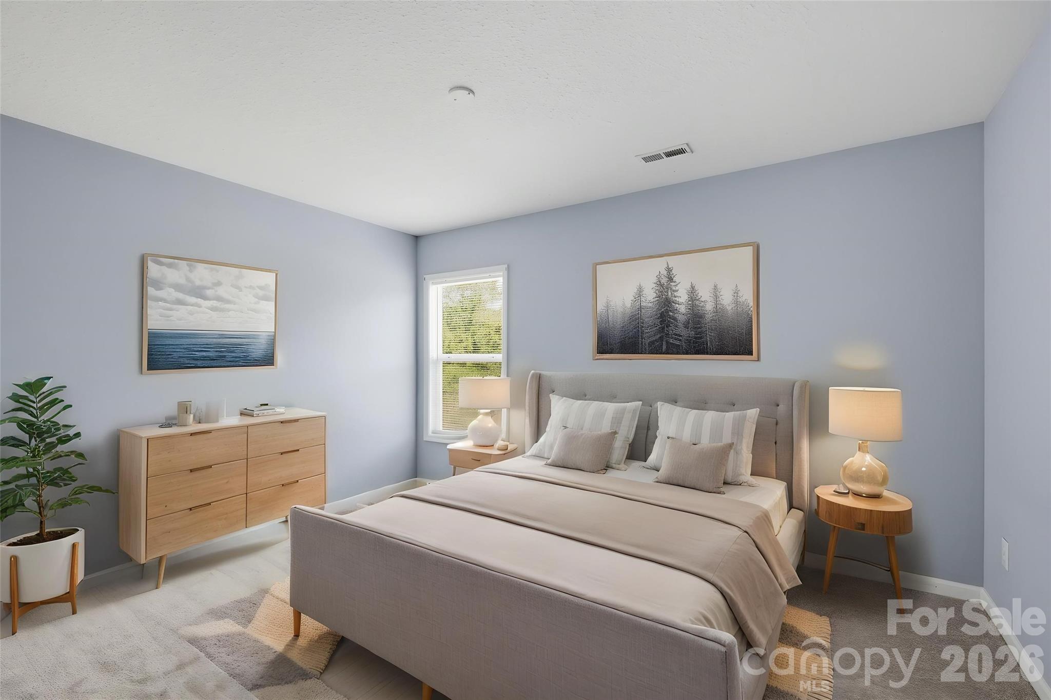 6404 Trotters Ridge Road Charlotte, NC 28227 - Photo 22 of 29 a bedroom with a bed and a painting on the wall