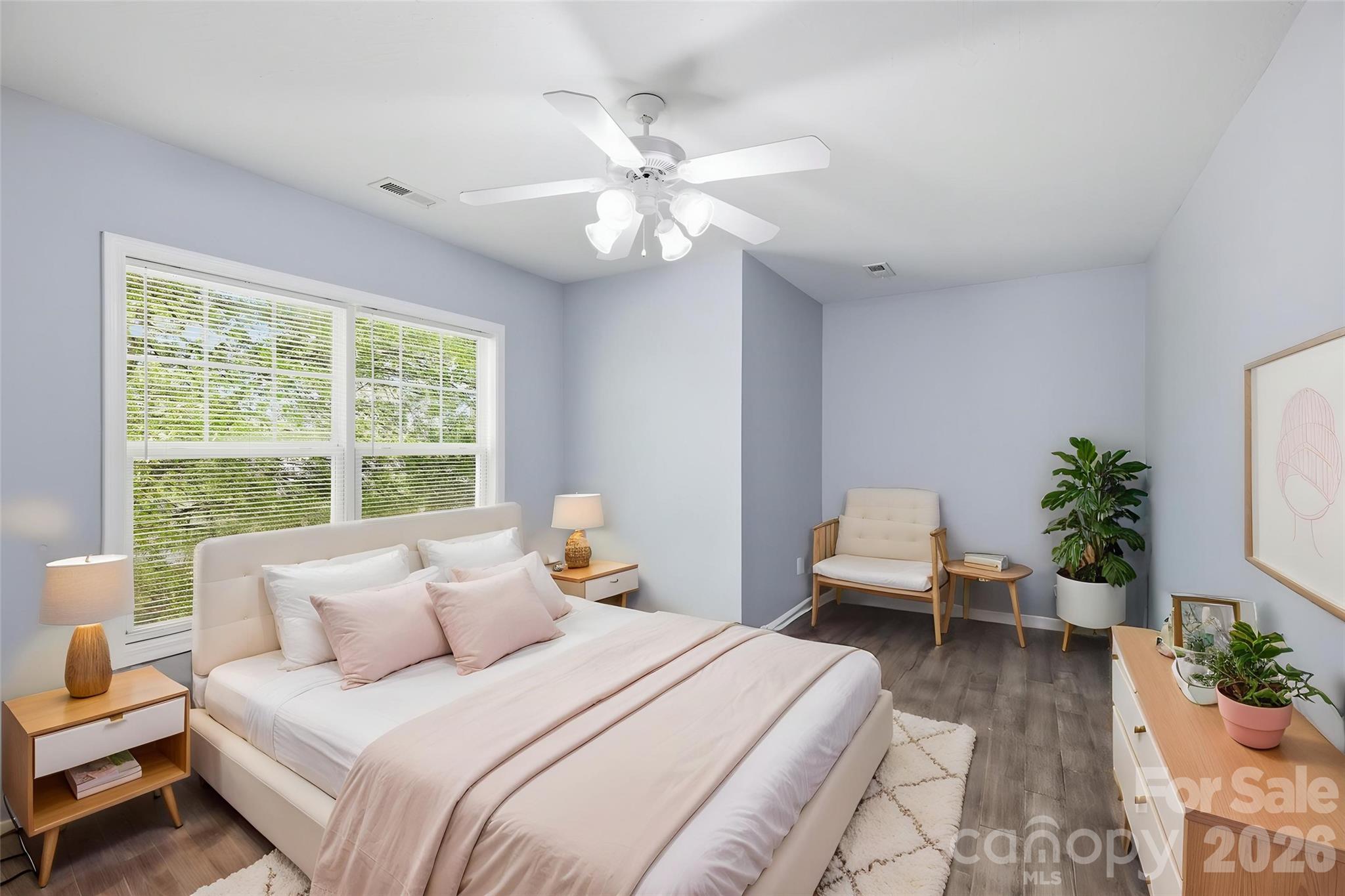 6404 Trotters Ridge Road Charlotte, NC 28227 - Photo 23 of 29 a bedroom with a bed and a chandelier