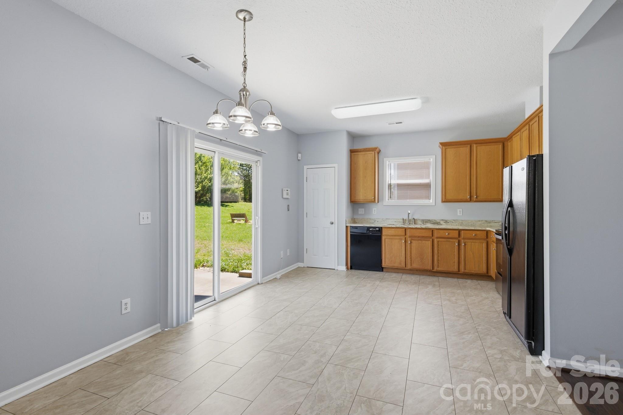 6404 Trotters Ridge Road Charlotte, NC 28227 - Photo 7 of 29 a view of a kitchen with a sink and windows