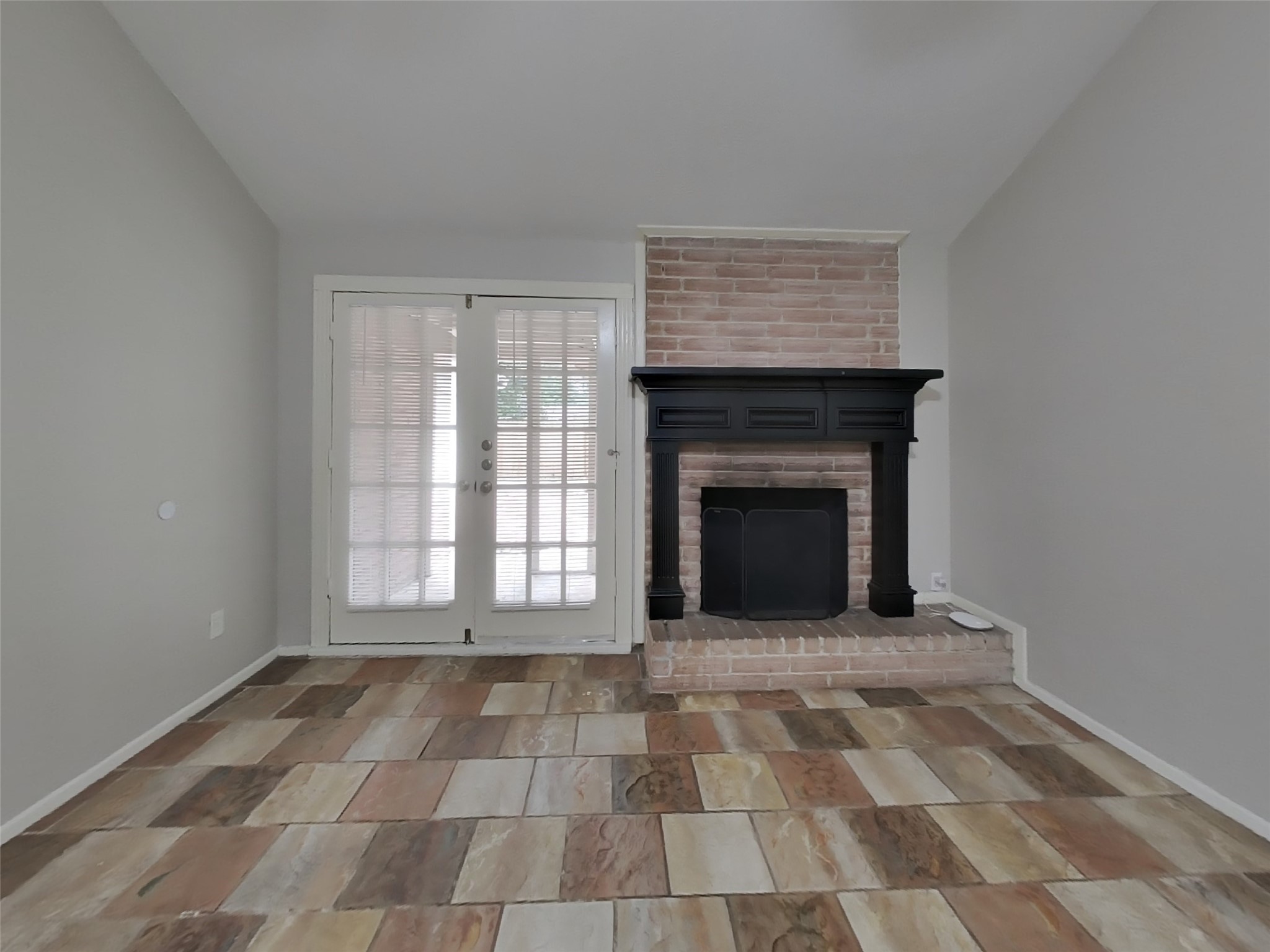 4422 Monteith Drive Spring, TX 77373 - Photo 2 of 18 a view of an empty room with a fireplace and a window