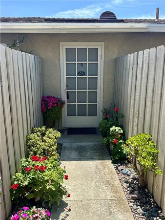 a view of a house with a flower garden