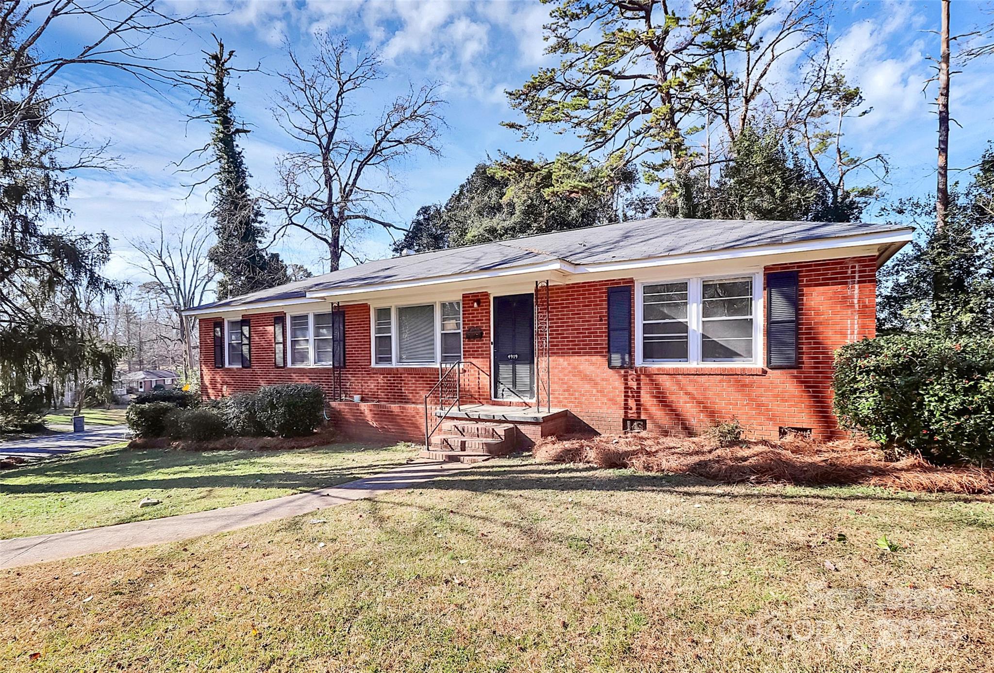 4919 Raymond Place Charlotte, NC 28205 - Photo 2 of 31 a backyard of a house with yard and outdoor seating