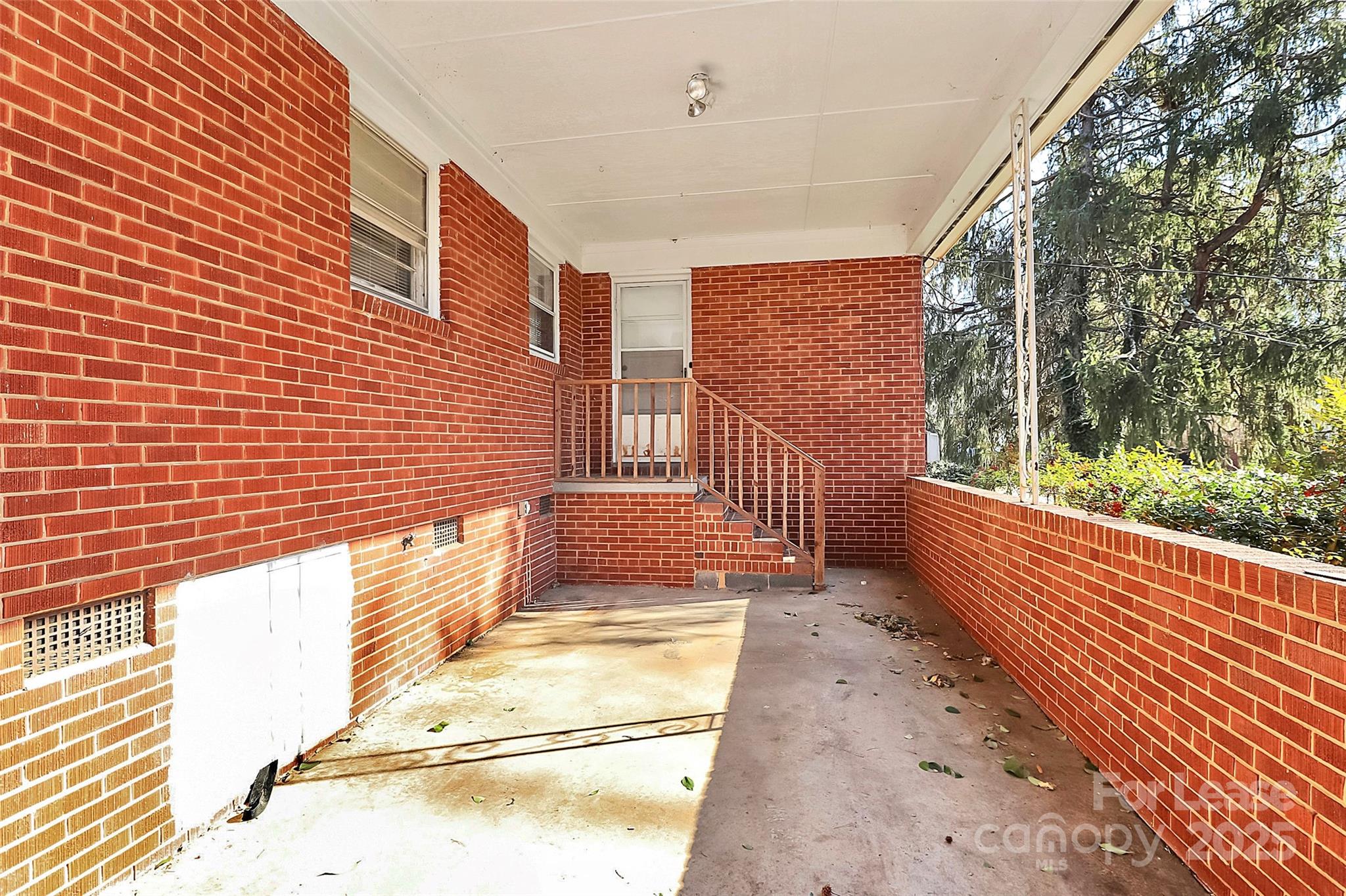 4919 Raymond Place Charlotte, NC 28205 - Photo 25 of 31 a view of a porch with wooden floor