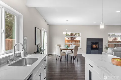 a kitchen with center island table and chairs