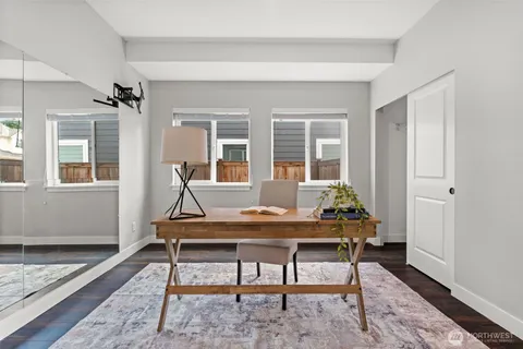 a room with furniture and wooden floor