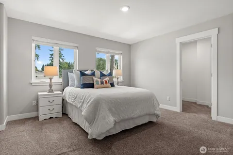 a bedroom with bed and window