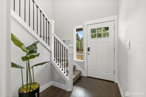 a view of entryway with wooden floor