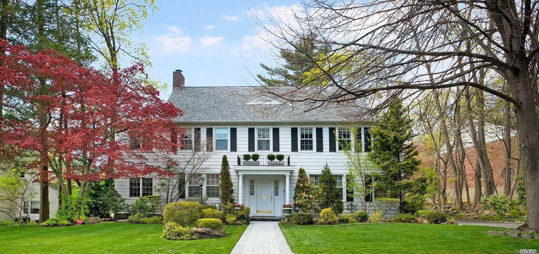 Undisclosed Address Great Neck, NY 11021 - Photo 1 of 1 a front view of a house with garden