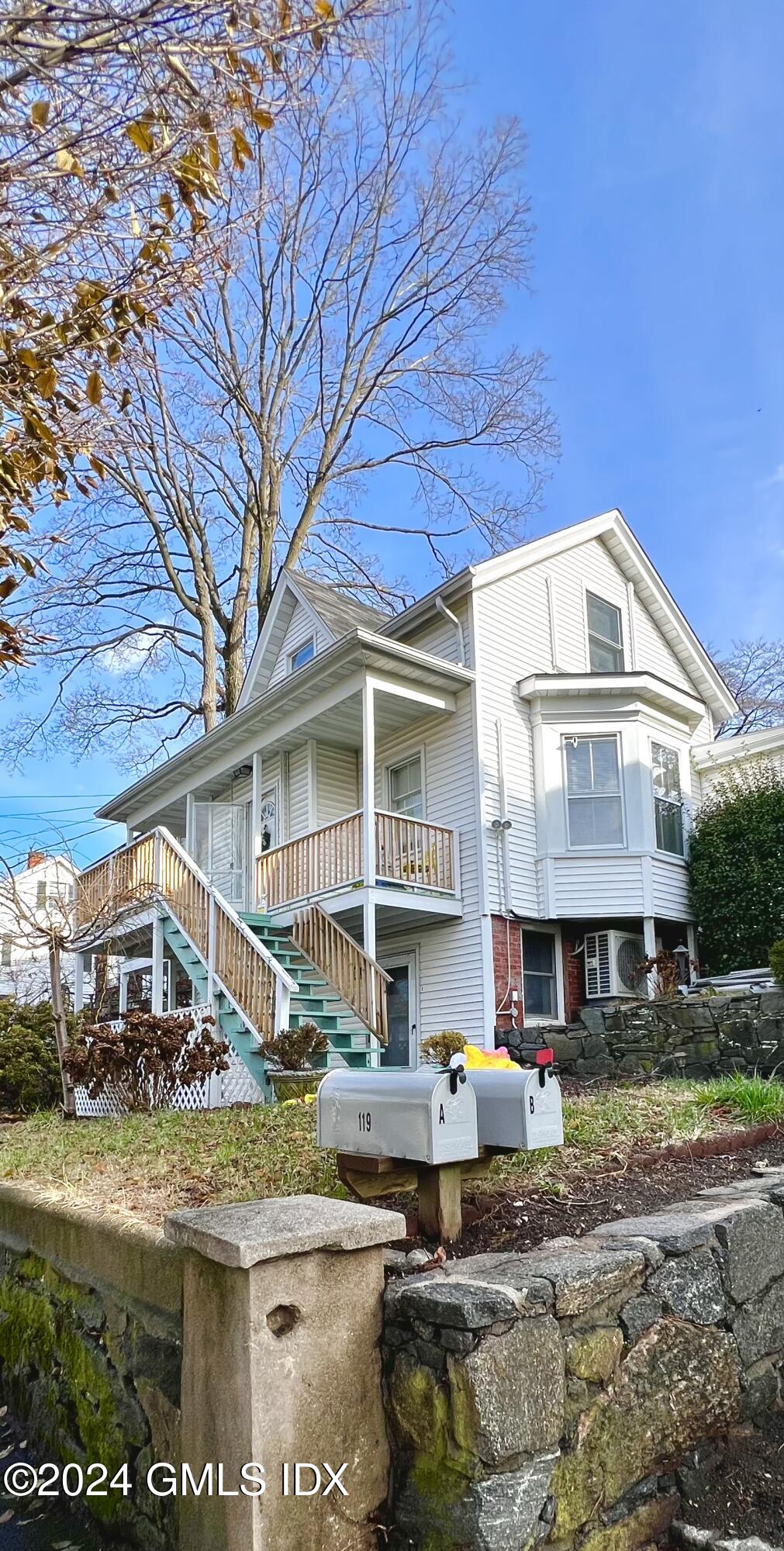 119 North Water Street, Unit 1 Greenwich, CT 06830 - Photo 1 of 11 a front view of a house with swimming pool
