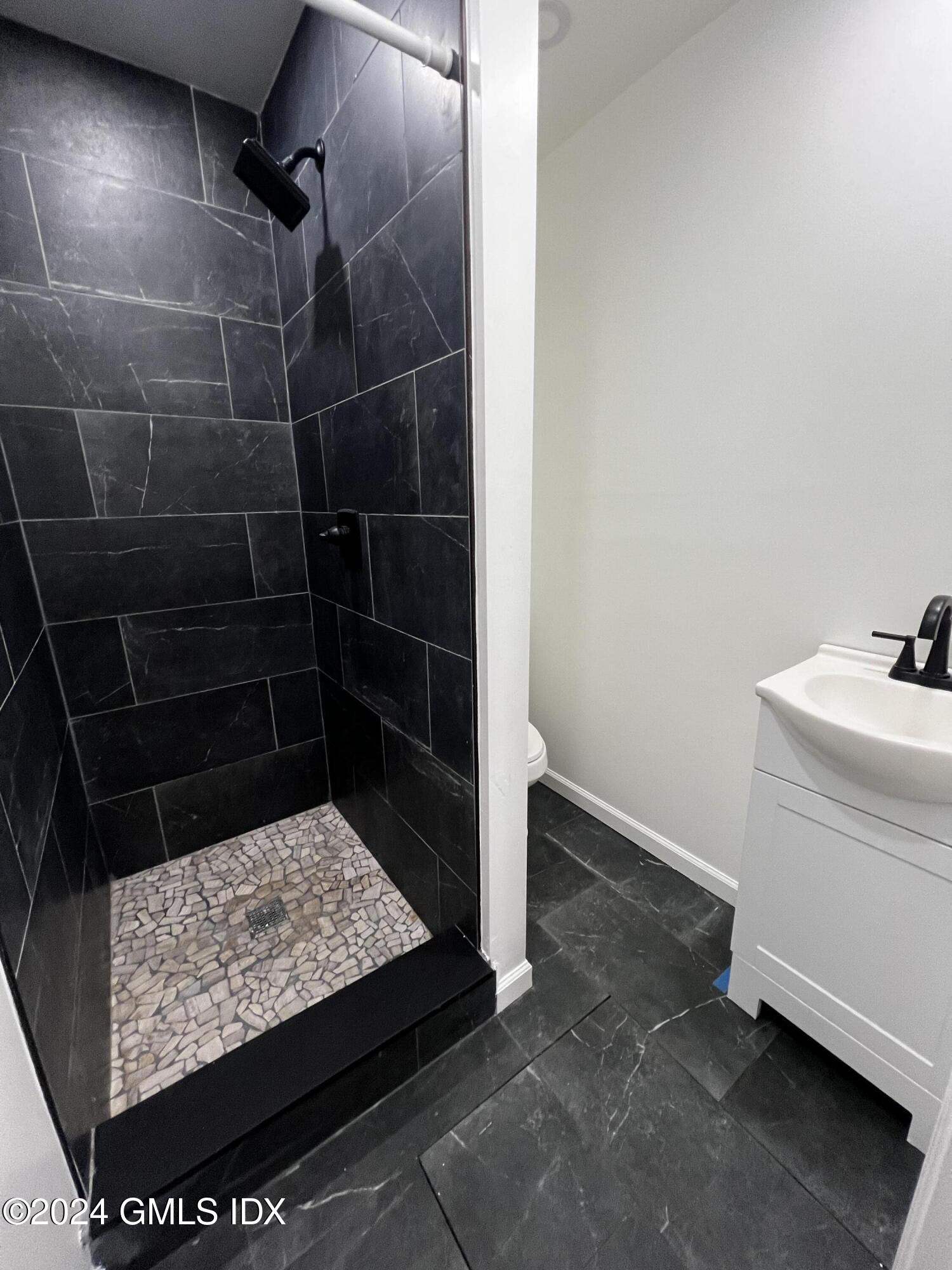 119 North Water Street, Unit 1 Greenwich, CT 06830 - Photo 7 of 11 a bathroom with a sink