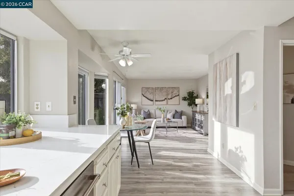 a view of a dining room with furniture window and wooden floor
