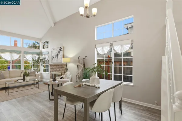 a view of a dining room with furniture window and outside view