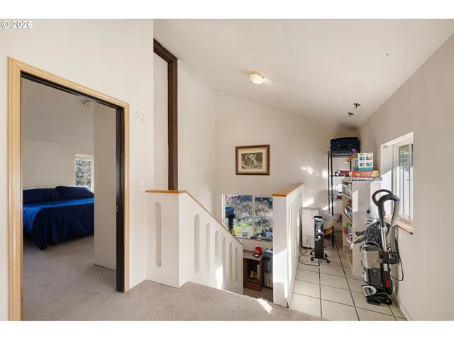 a view of a livingroom with furniture and a flat screen tv