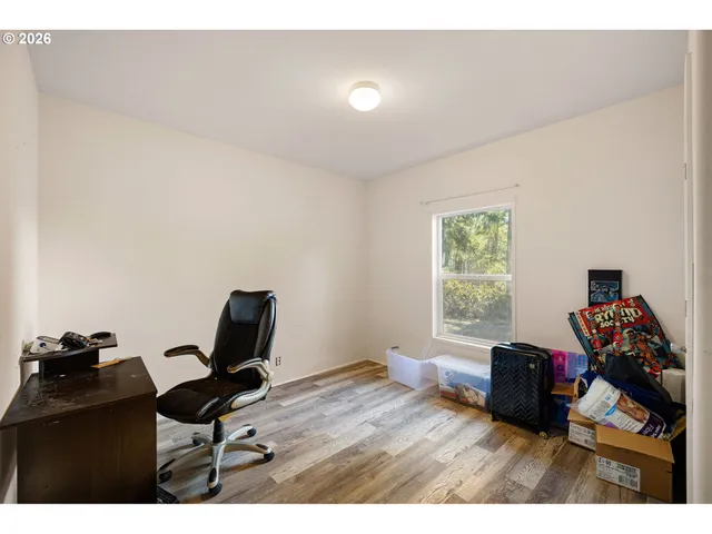 a bathroom with a granite countertop sink a large mirror a and a bathtub