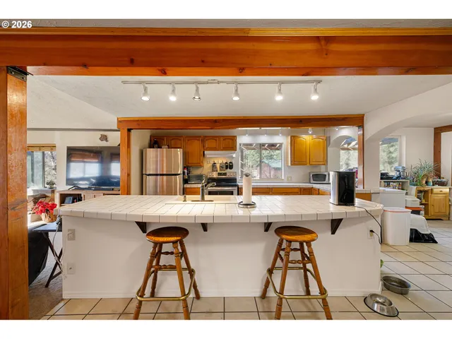 a kitchen with a table and chairs
