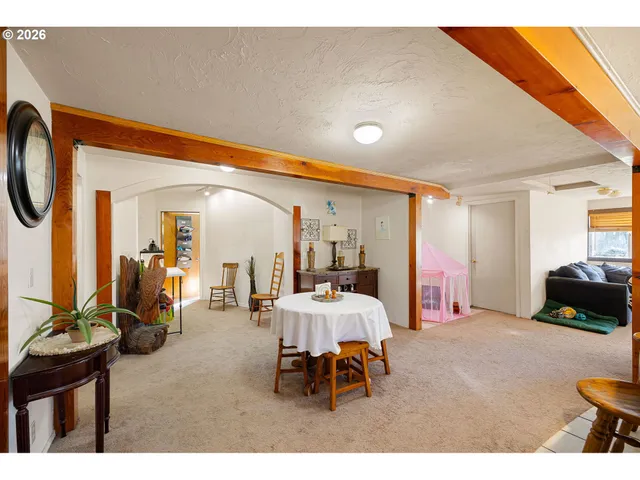 a living room with furniture and a lamp