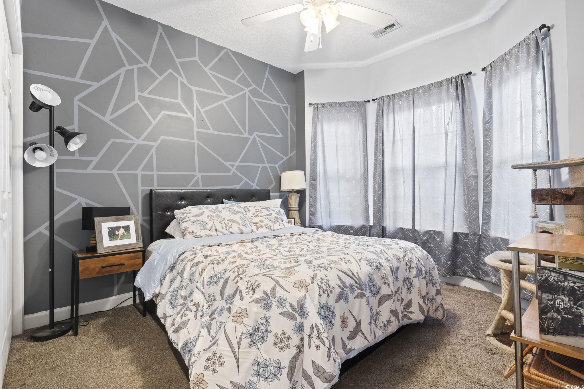 785 Rambler Court Myrtle Beach, SC 29588 - Photo 10 of 25 Carpeted bedroom featuring a textured ceiling and ceiling fan