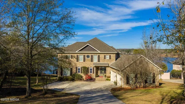 a view of park with large trees